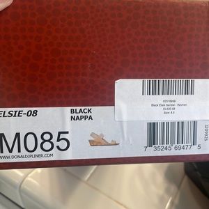 Donald Pliner. Size 8.5 black patent leather wedge  heel.